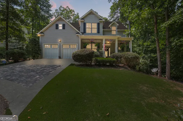 an aerial view of a house with a yard