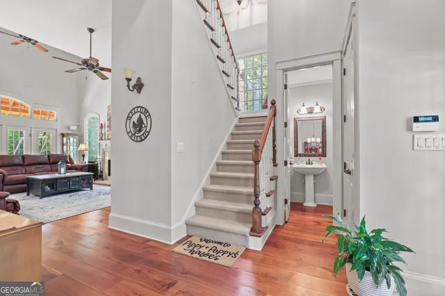 a bathroom with a sink toilet and mirror