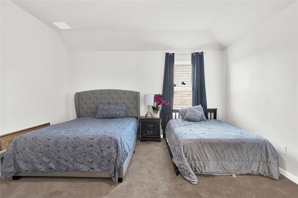 3712 Maroon Creek Road Aubrey, TX 76227 - Photo 16 of 21 a bedroom with bed and a window