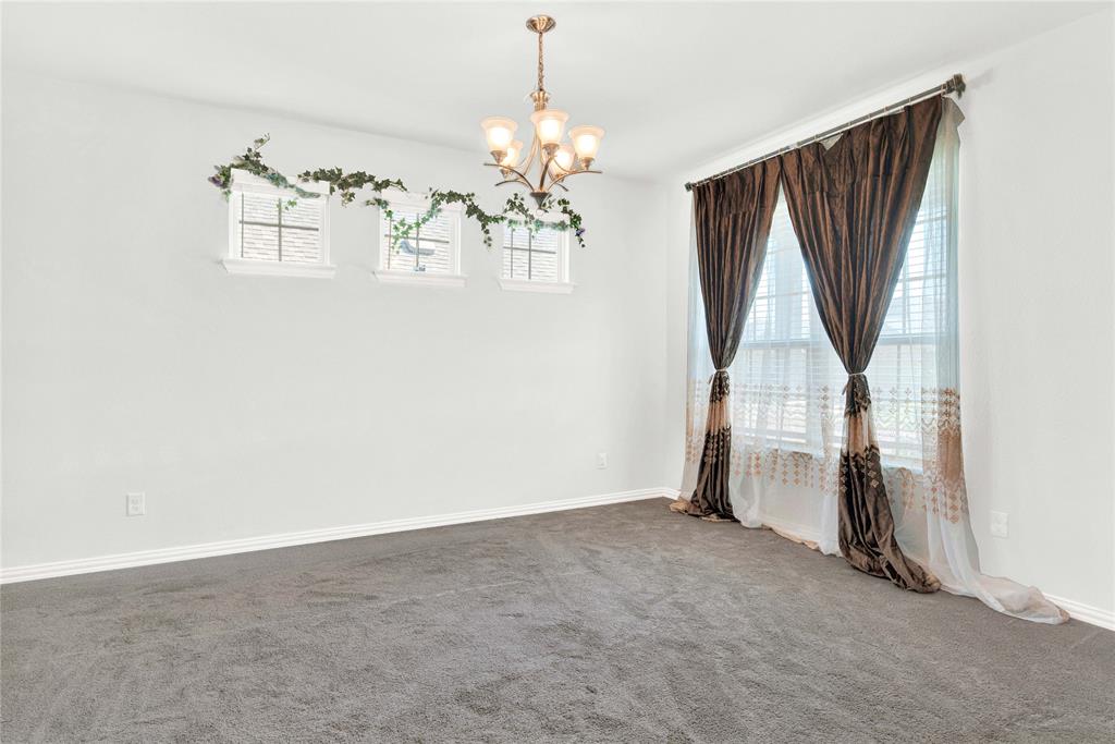3712 Maroon Creek Road Aubrey, TX 76227 - Photo 2 of 21 an empty room with windows and stairs
