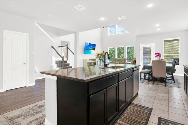 a kitchen with counter top space and sink