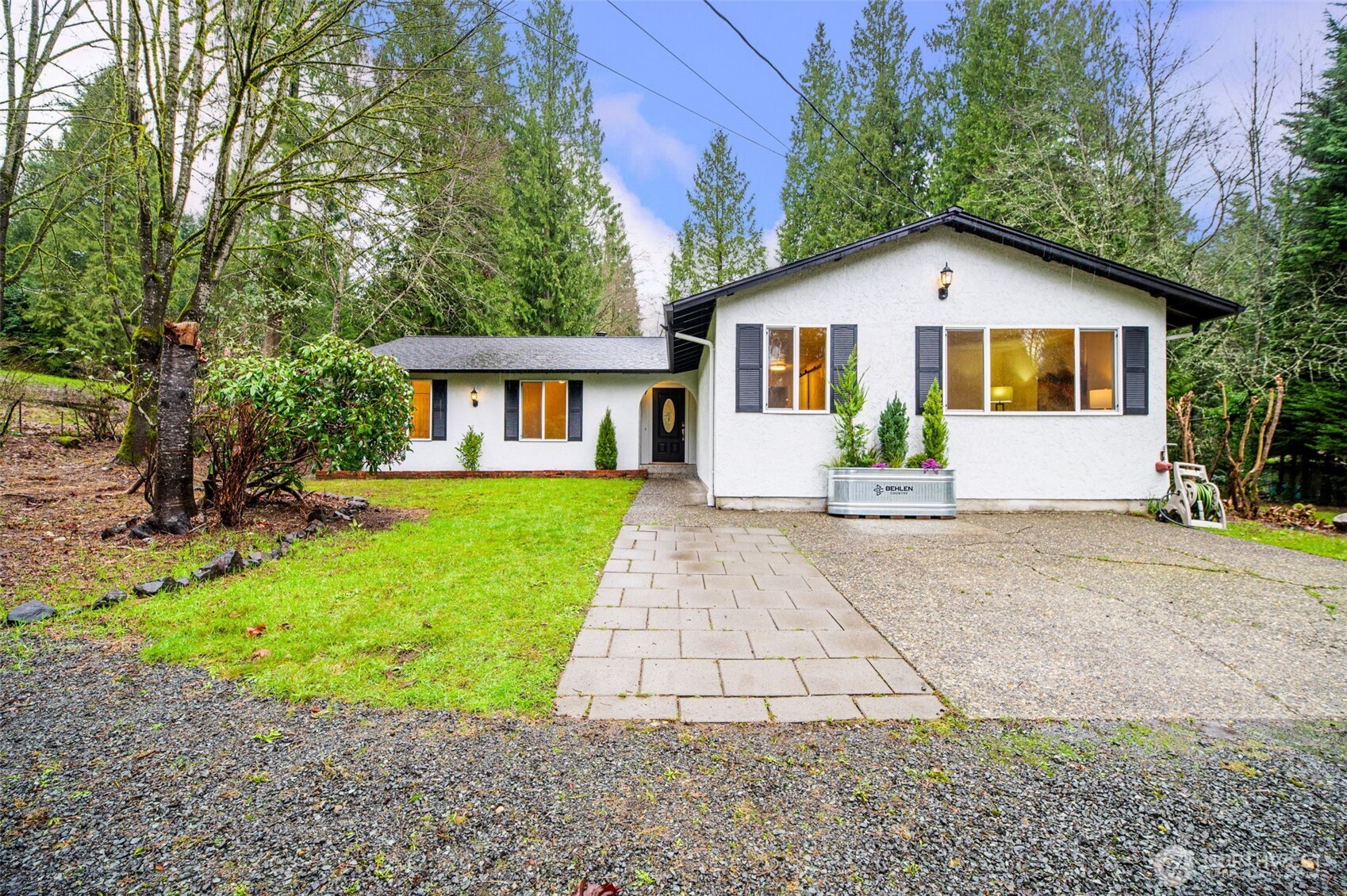 22629 57th Avenue Southeast Bothell, WA 98021 - Photo 5 of 40 a front view of a house with a yard and garage