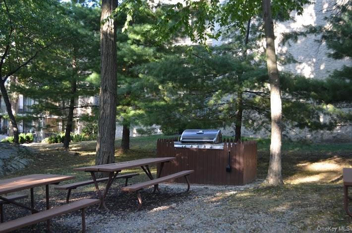 150 Overlook Avenue, Unit 4L Peekskill, NY 10566 - Photo 9 of 32 a view of a bench in a backyard