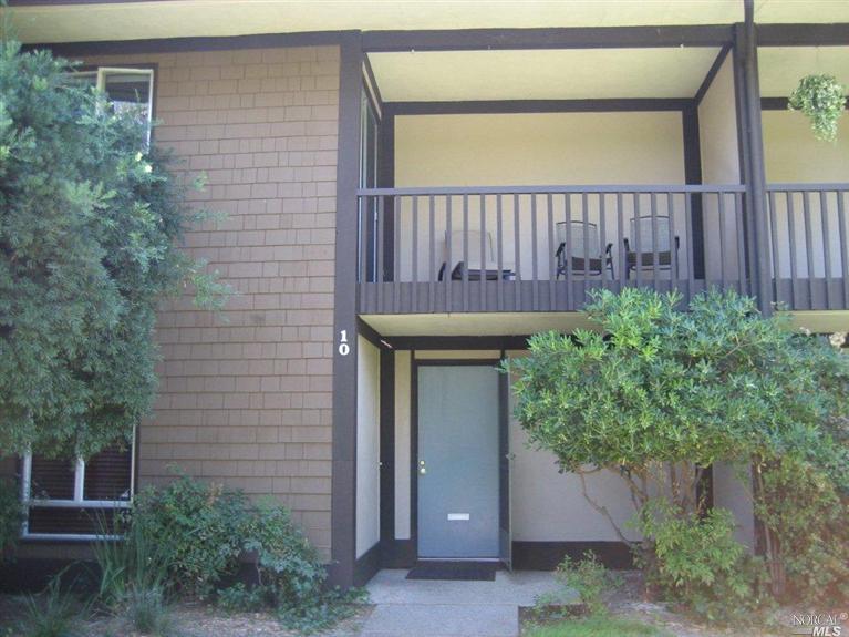 10 Surrey Lane San Rafael, CA 94903 - Photo 1 of 1 a brick house with a garden and plants