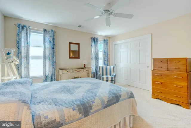 a bedroom with a bed and a dresser