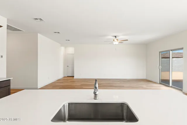 a kitchen with stainless steel appliances granite countertop a sink and a microwave