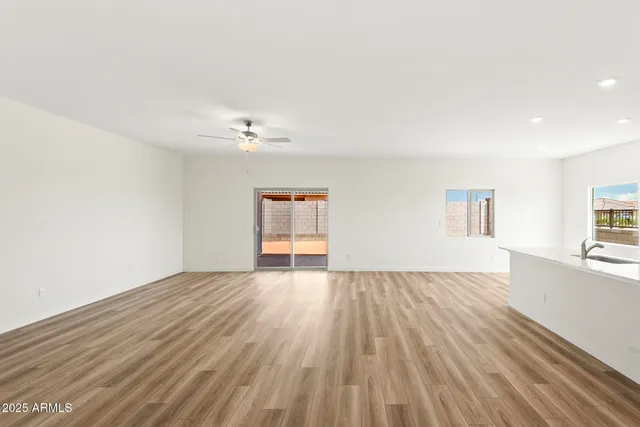 a kitchen with stainless steel appliances a refrigerator sink and microwave