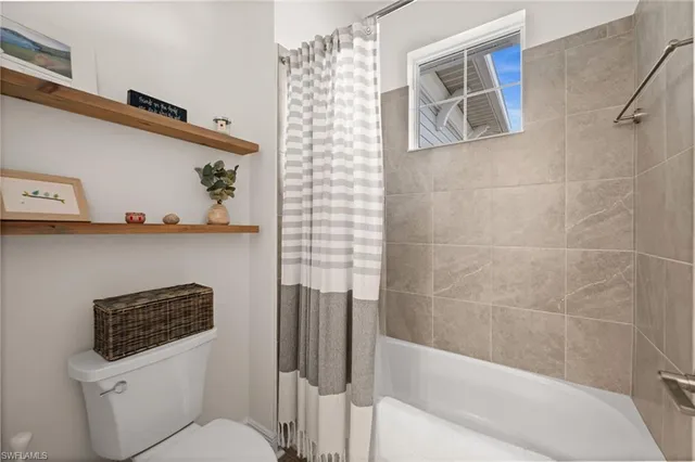 a bathroom with a sink a mirror and a lamp