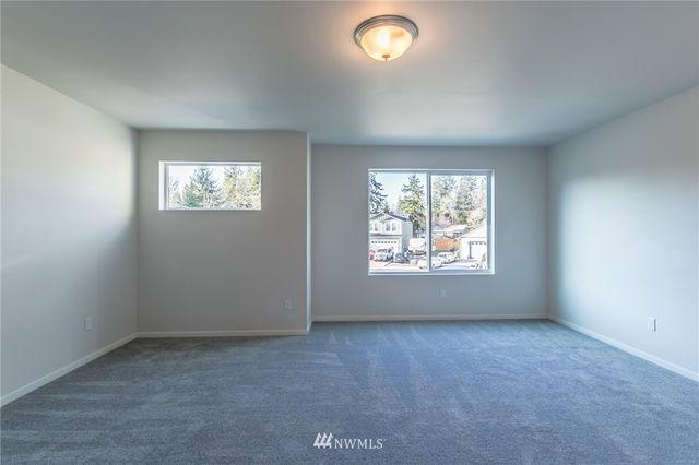 a bathroom with a sink double vanity and a mirror