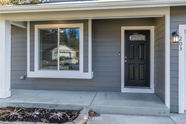 a view of a living hall with wooden floor