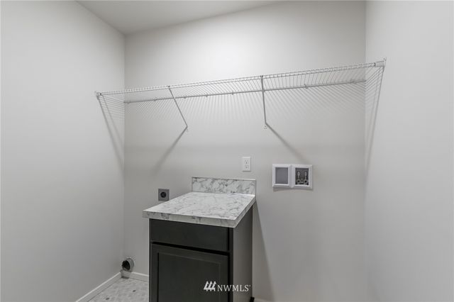 a view of a house with a yard and plants