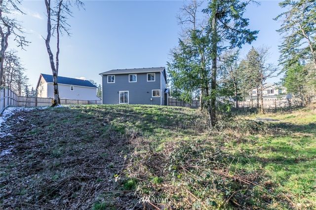 a view of street with large trees