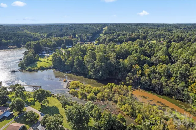 an aerial view of a houses with a yard