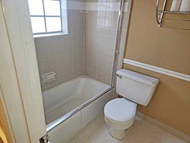 2040 Ridgeway Road Memphis, TN 38119 - Photo 19 of 35 a white toilet sitting next to a bath tub