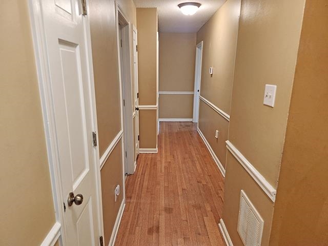 2040 Ridgeway Road Memphis, TN 38119 - Photo 20 of 35 a view of a hallway with wooden floor and staircase