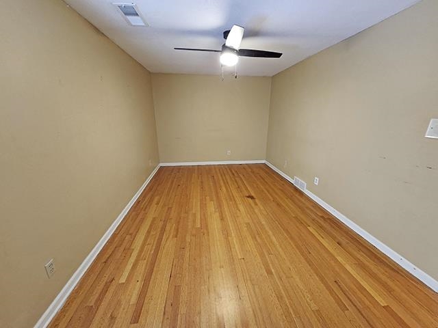 2040 Ridgeway Road Memphis, TN 38119 - Photo 23 of 35 a view of a room with wooden floor and a ceiling fan