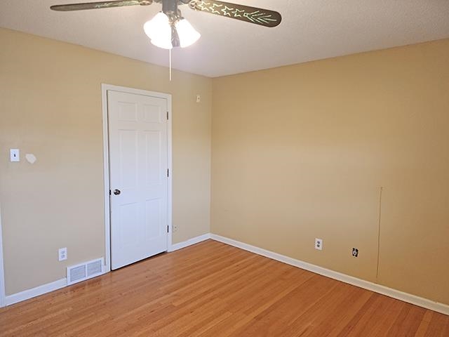 2040 Ridgeway Road Memphis, TN 38119 - Photo 24 of 35 wooden floor in an empty room with a window