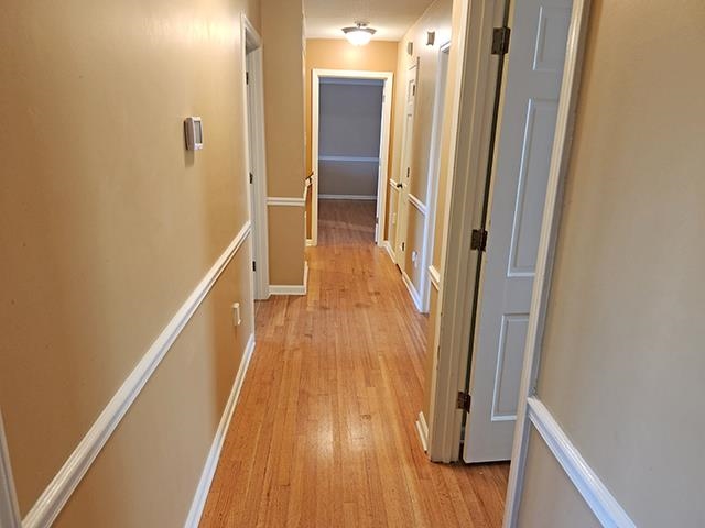 2040 Ridgeway Road Memphis, TN 38119 - Photo 26 of 35 a view of a hallway with wooden floor and staircase