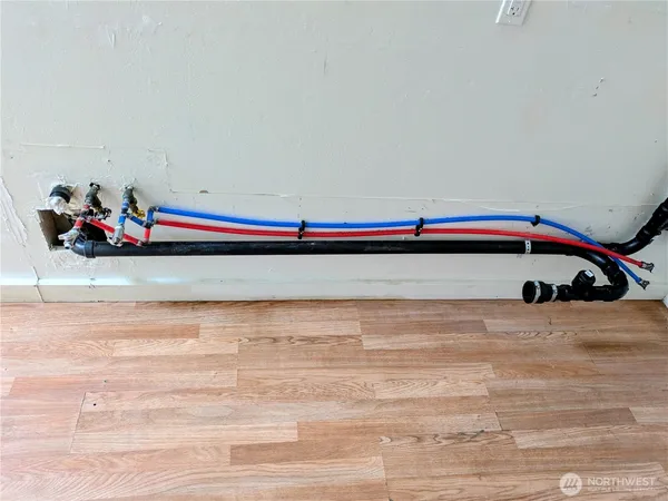 a room with a wooden floor and a small yard