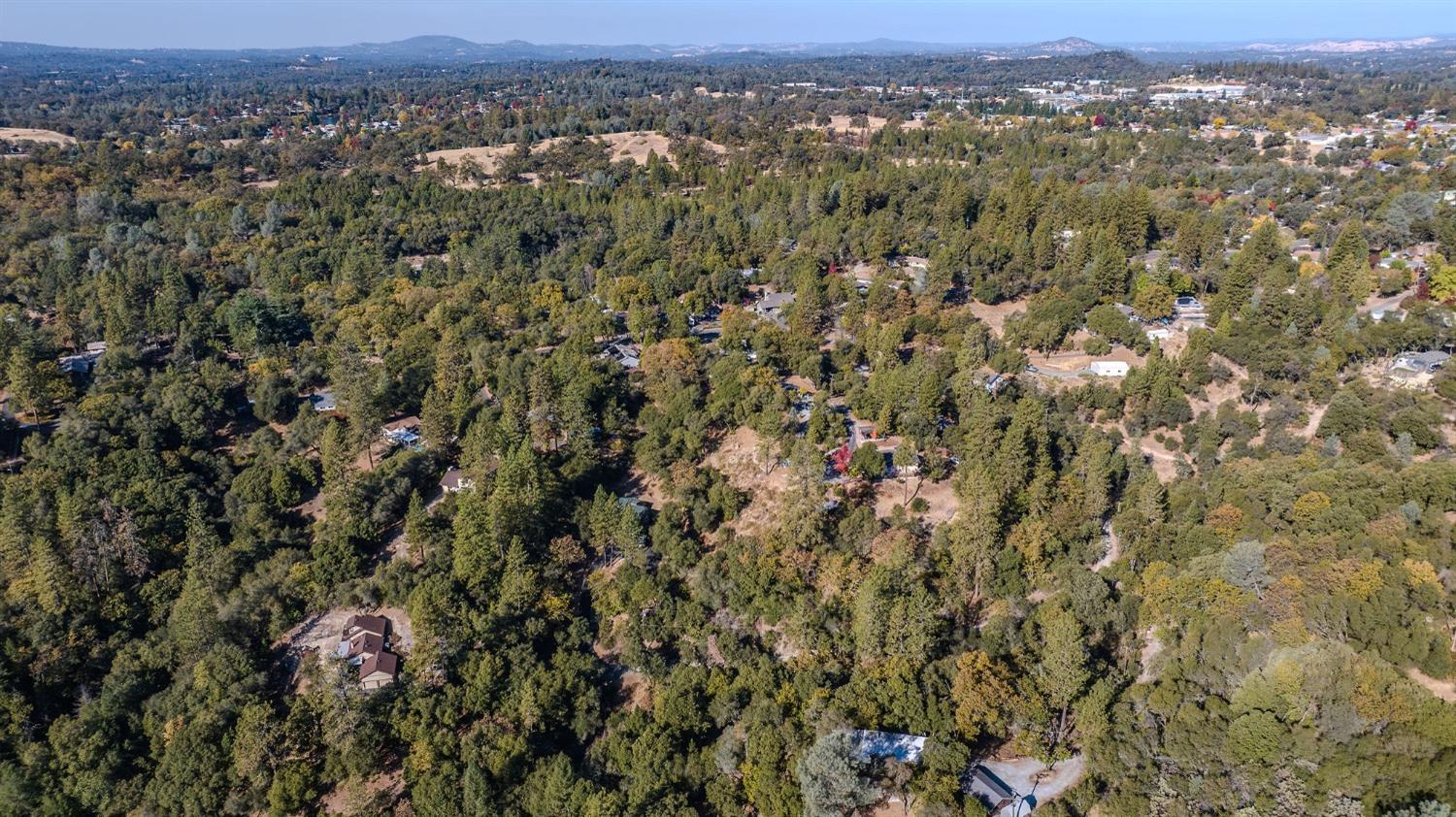 5793 Forest Lake Road Diamond Springs, CA 95619 - Photo 22 of 27 an aerial view of residential houses with city and mountain view