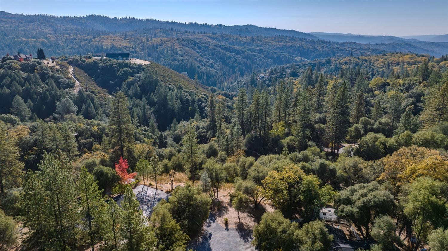 5793 Forest Lake Road Diamond Springs, CA 95619 - Photo 24 of 27 a view of a lush green hillside and houses