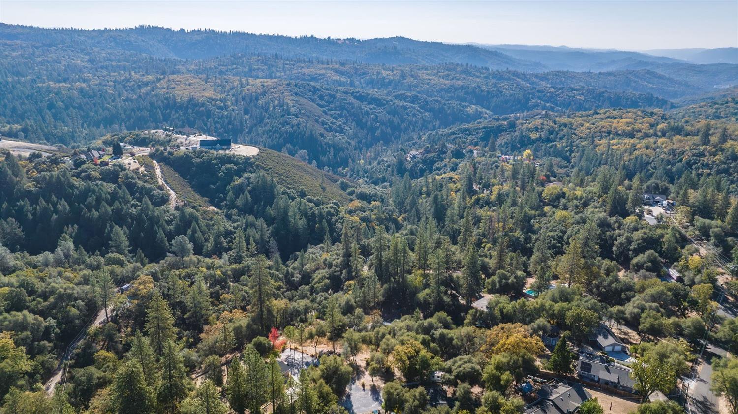 5793 Forest Lake Road Diamond Springs, CA 95619 - Photo 27 of 27 a view of a lush green hillside and a building