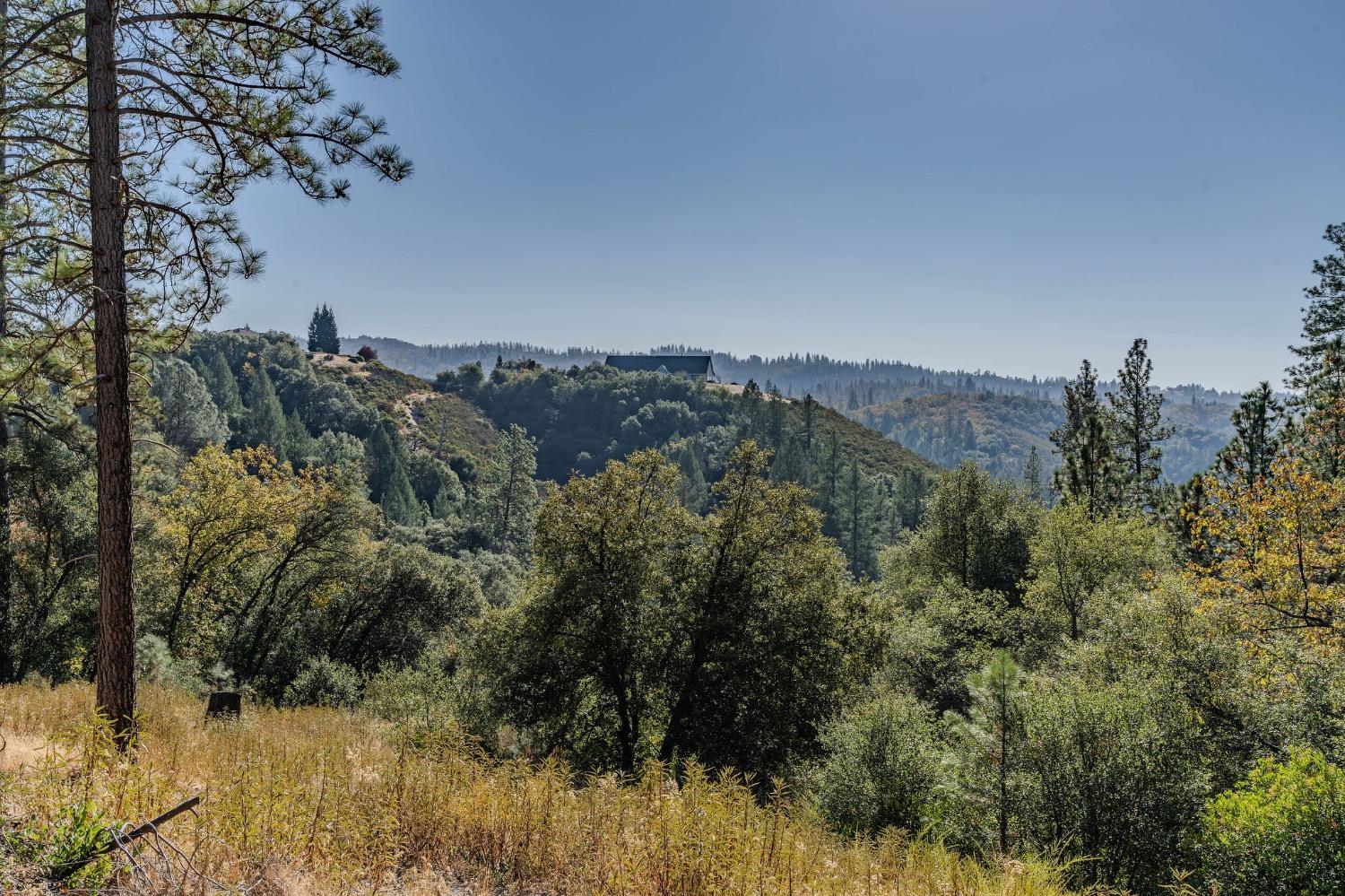 5793 Forest Lake Road Diamond Springs, CA 95619 - Photo 5 of 27 a view of a house with a mountain in the background