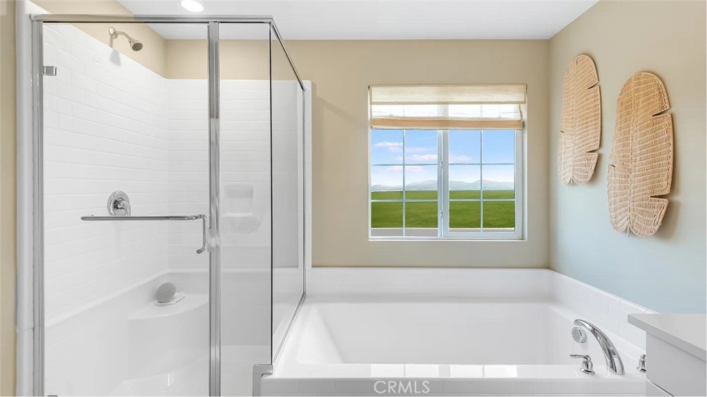 1333 Yeager Avenue Rialto, CA 92376 - Photo 12 of 18 a bathroom with a bathtub and a shower