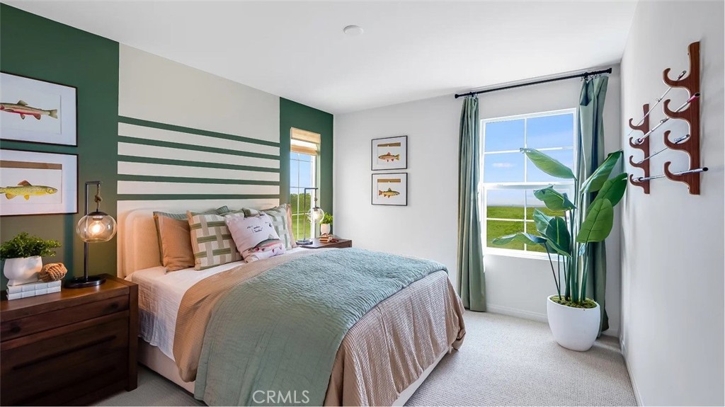 1333 Yeager Avenue Rialto, CA 92376 - Photo 8 of 18 a bedroom with a large bed and a potted plant