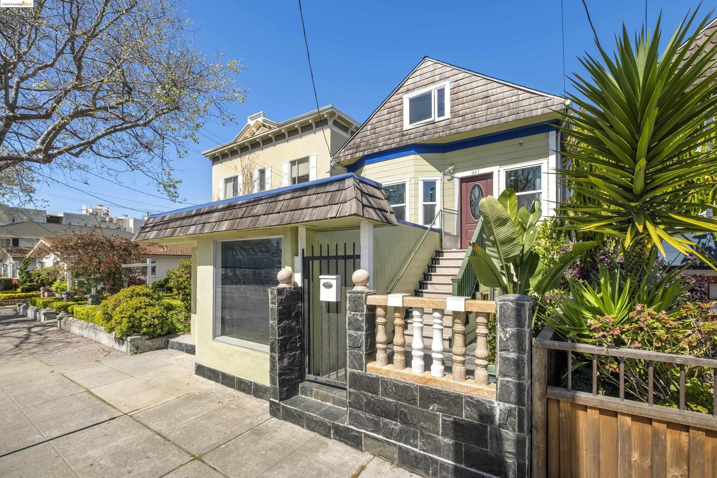 a front view of a house with a garden