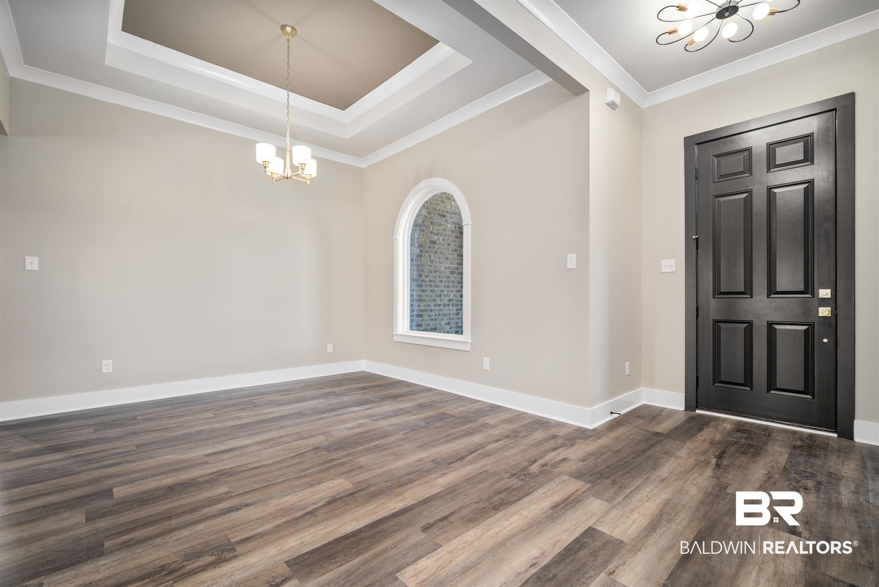 188 Hampton Ridge Mobile, AL 36608 - Photo 12 of 37 Entrance foyer featuring a raised ceiling, crown molding, 8 foot front door. Formal dining room to the right.