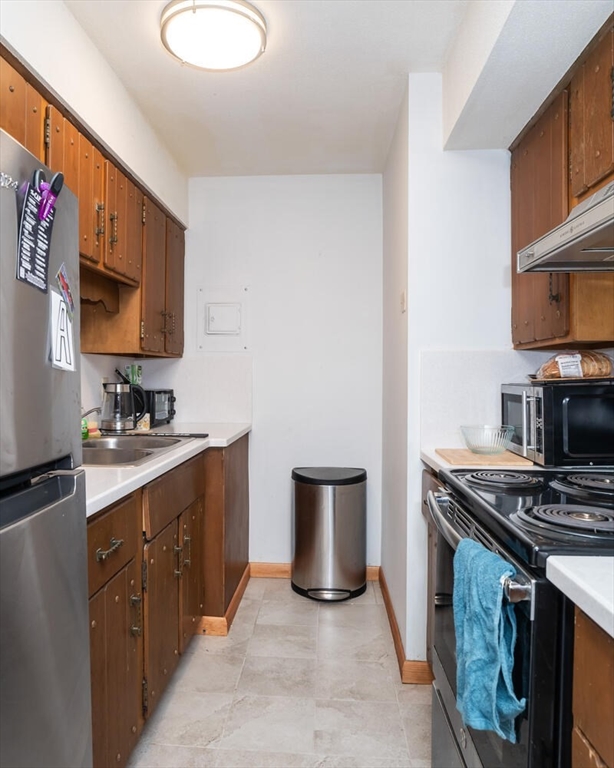 11 Plumtree Road Sunderland, MA 01375 - Photo 13 of 42 a kitchen with stainless steel appliances a sink stove and cabinets
