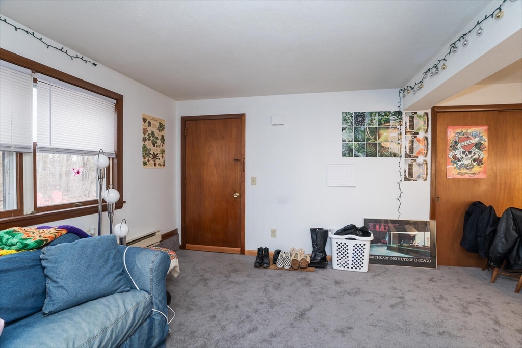 11 Plumtree Road Sunderland, MA 01375 - Photo 15 of 42 a living room with furniture and a window