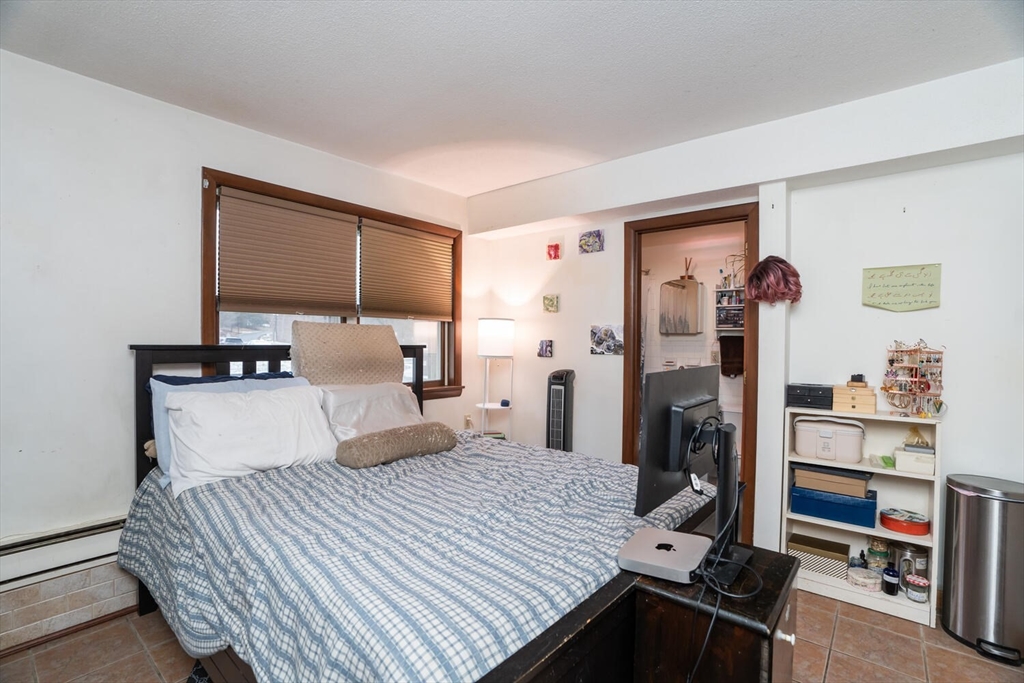 11 Plumtree Road Sunderland, MA 01375 - Photo 2 of 42 a bedroom with a bed and a flat tv screen