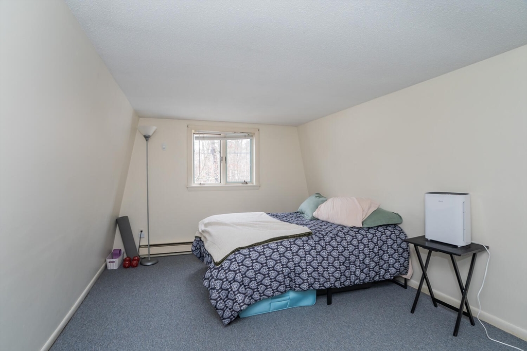 11 Plumtree Road Sunderland, MA 01375 - Photo 22 of 42 a bedroom with a bed chair and a window