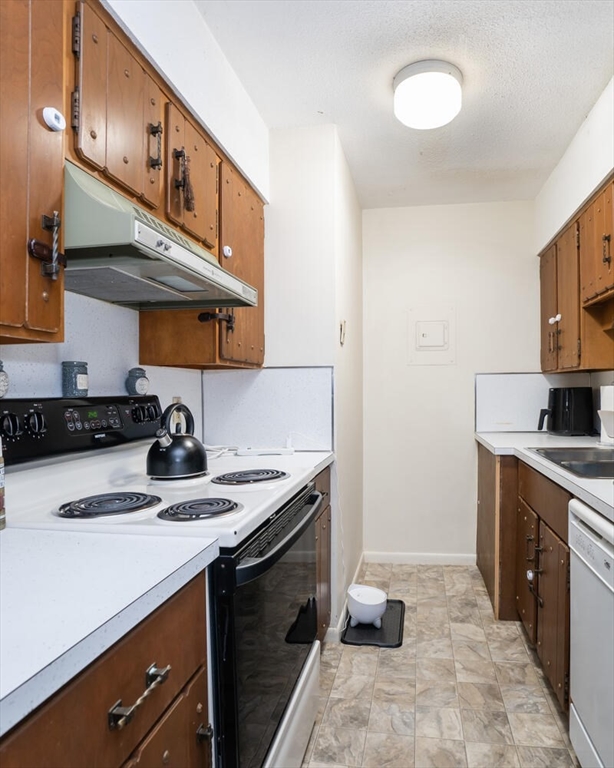 11 Plumtree Road Sunderland, MA 01375 - Photo 25 of 42 a kitchen with stainless steel appliances granite countertop a sink stove and cabinets