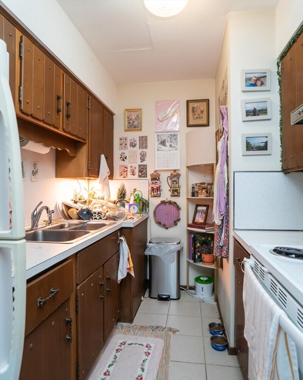 11 Plumtree Road Sunderland, MA 01375 - Photo 30 of 42 a kitchen with a sink stove and cabinets