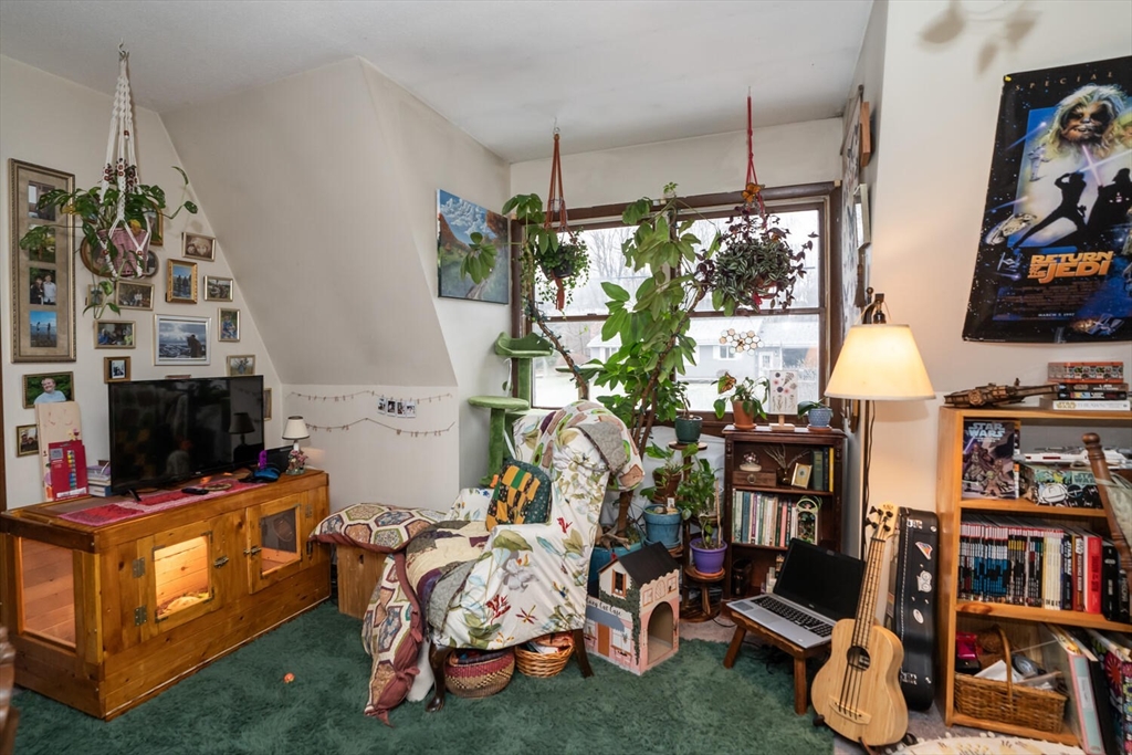 11 Plumtree Road Sunderland, MA 01375 - Photo 32 of 42 a room with lots of furniture and a flat screen tv