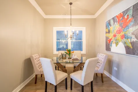 a dining room with furniture and window