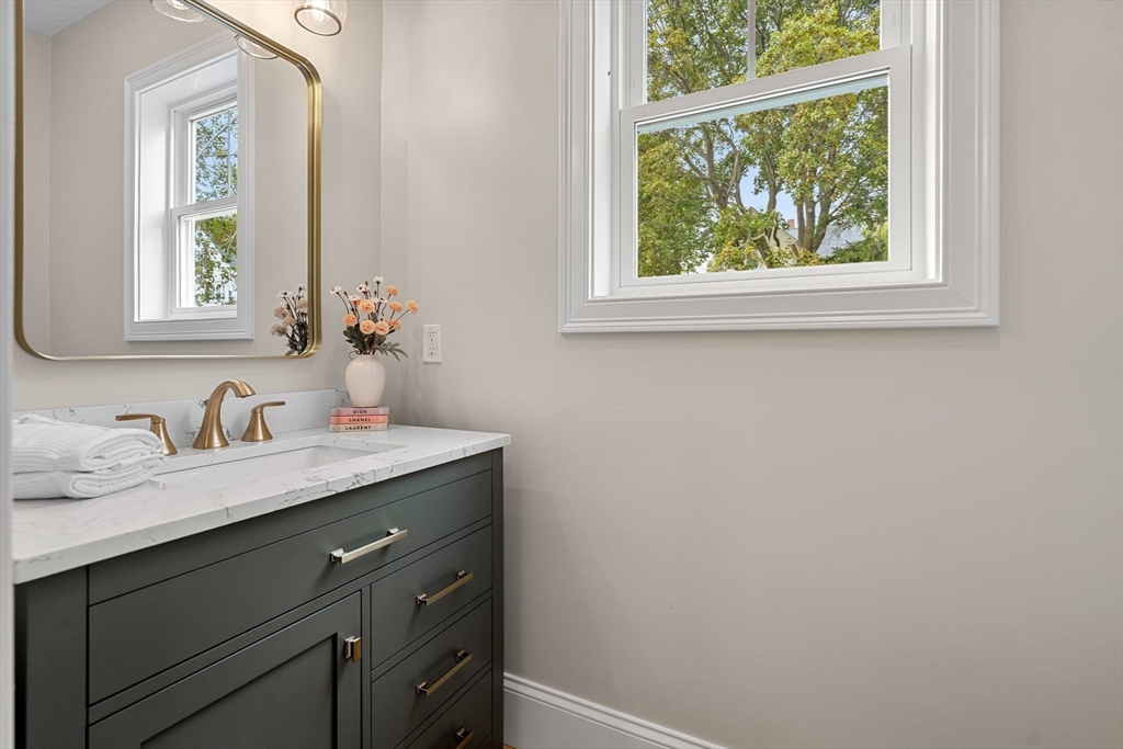 61 Mt Pleasant Street Woburn, MA 01801 - Photo 16 of 39 a view of bathroom with a sink and a window