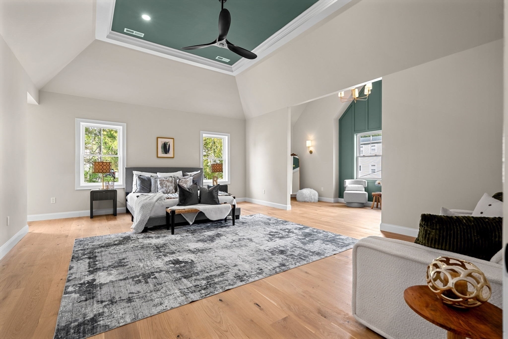 61 Mt Pleasant Street Woburn, MA 01801 - Photo 17 of 39 a living room with furniture and a wooden floor