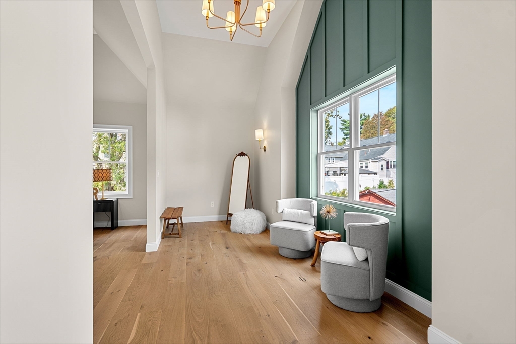 61 Mt Pleasant Street Woburn, MA 01801 - Photo 20 of 39 a living room with furniture and a large window