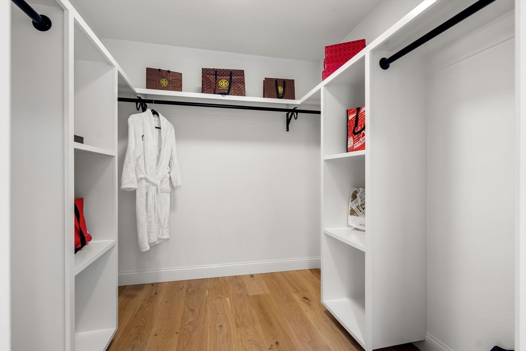61 Mt Pleasant Street Woburn, MA 01801 - Photo 22 of 39 a view of walk in closet with clothes and shoes