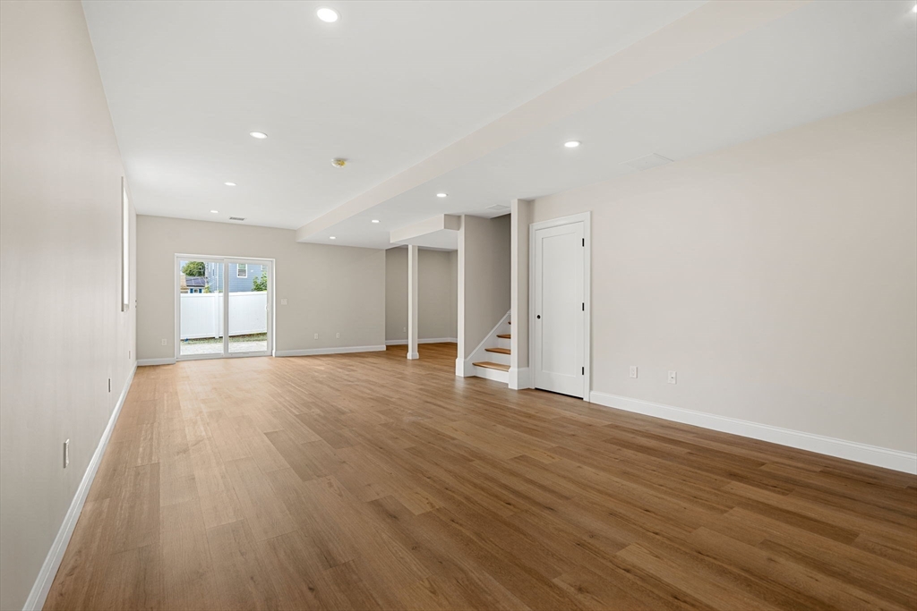 61 Mt Pleasant Street Woburn, MA 01801 - Photo 32 of 39 a view of empty room with wooden floor and window