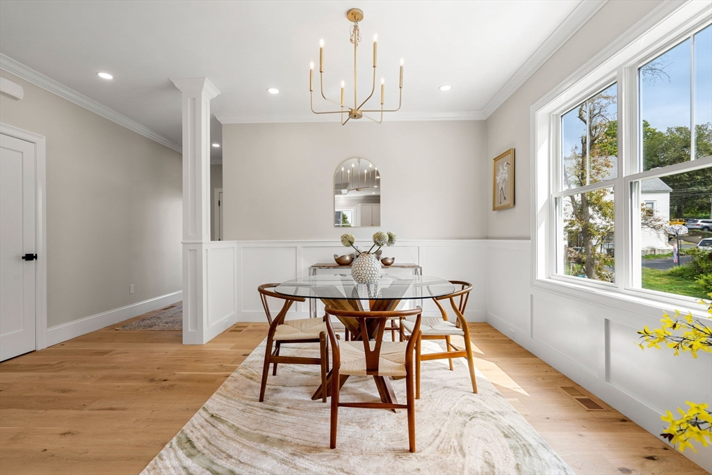 61 Mt Pleasant Street Woburn, MA 01801 - Photo 6 of 39 a view of a dining room with furniture window and wooden floor