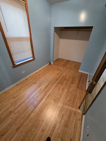 a view of staircase with wooden floor and door