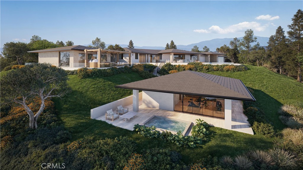 80 Saddleback Road Rolling Hills, CA 90274 - Photo 14 of 43 a aerial view of a house with a yard and table and chairs under an umbrella