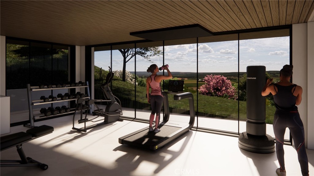 80 Saddleback Road Rolling Hills, CA 90274 - Photo 26 of 43 a room with gym equipment and a large window