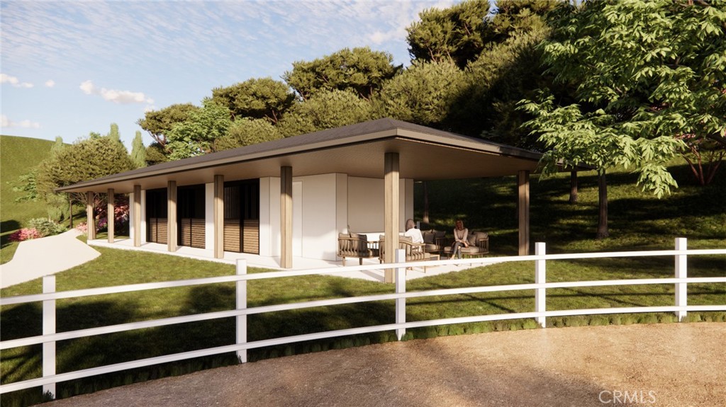 80 Saddleback Road Rolling Hills, CA 90274 - Photo 32 of 43 a view of a house with a large window and a tree