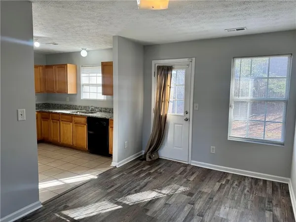 a view of a kitchen with a sink and cabinets